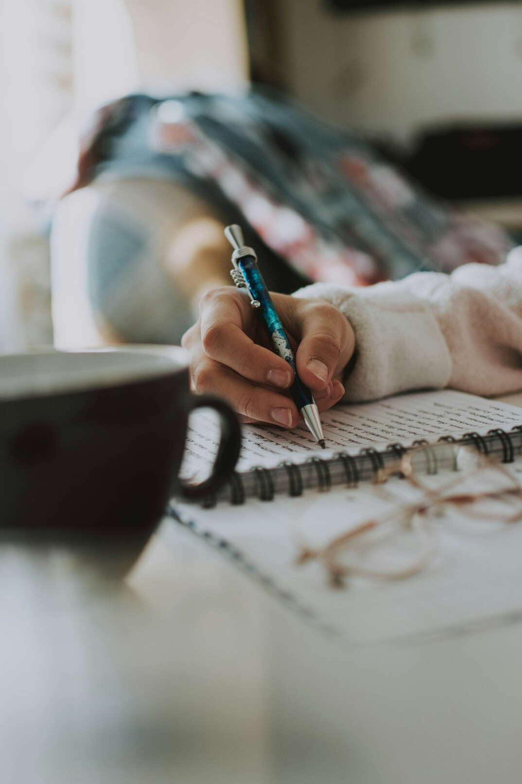 writer at desk with notes
